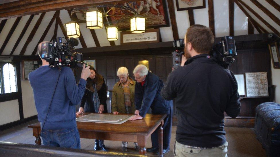 Dame Judi Dench and John Craven filming