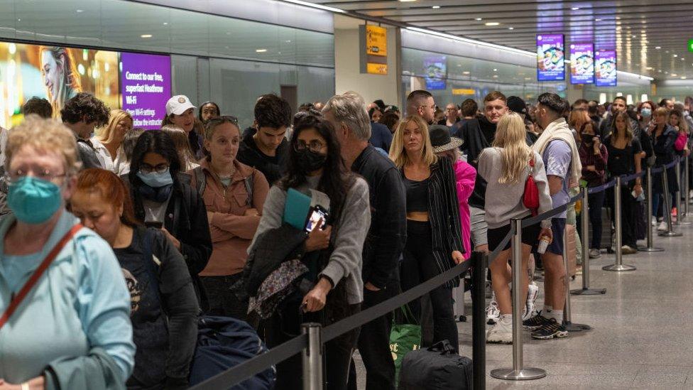 Queues for security at Heathrow Airport in June