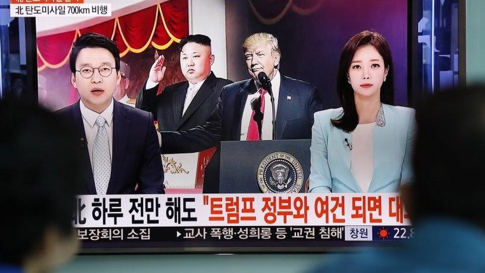 South Koreans watch a television displaying news broadcasts reporting on North Korea's recent ballistic missile launch, at a station in Seoul, South Korea, 14 May 2017.