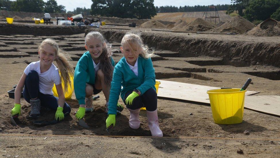 Children from Rendlesham Primary School excavating pits in Rendlesham