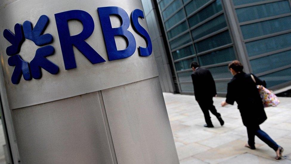 People walk past the London headquarters of the Royal Bank of Scotland