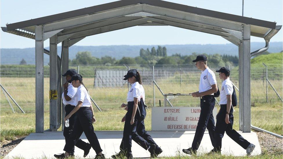 Young people of the SNU (Service National Universel) walk on the Luxeuil-Saint Sauveur air-base 116 in Saint-Sauveur, eastern France, on June 24, 2019