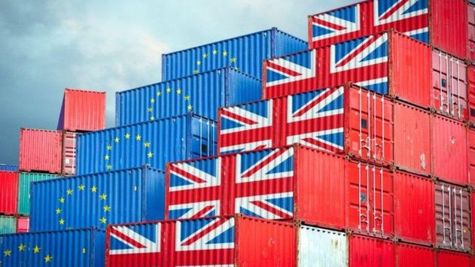 Shipping containers marked with EU and union flags