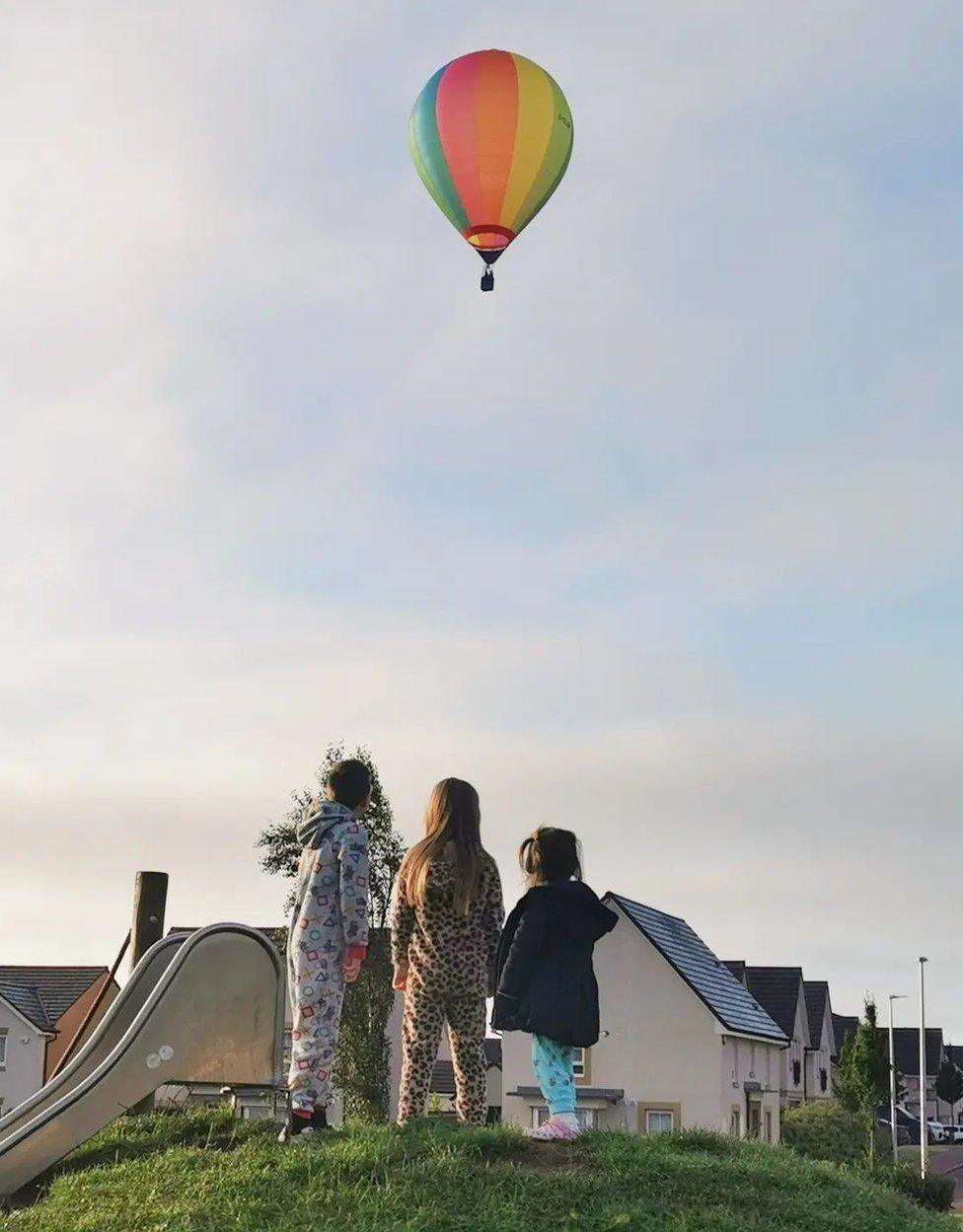 Kate Mitchell took this photo of some early risers out in their pyjamas to watch the balloons.