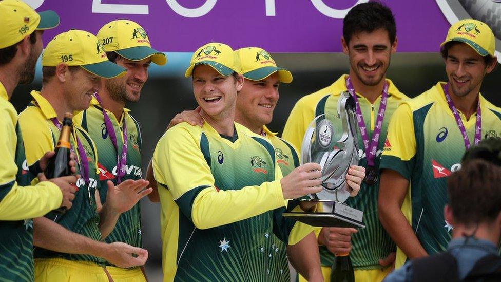 Steve Smith and the Australia team celebrate with the Trophy after victory in the 5th Royal London One-Day International match between England and Australia at Old Trafford on September 13, 2015 in Manchester, United Kingdom