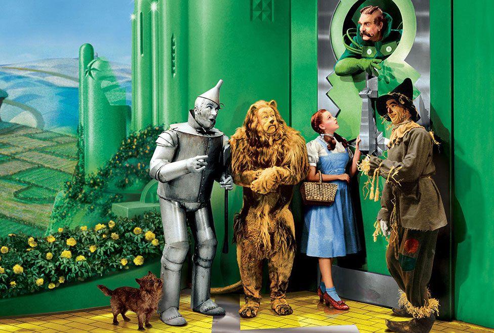 Still image of Judy Garland with fellow cast members in the 1939 film the Wizard of Oz 