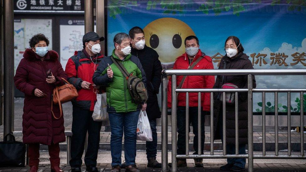 people-waiting-at-bus-stop.