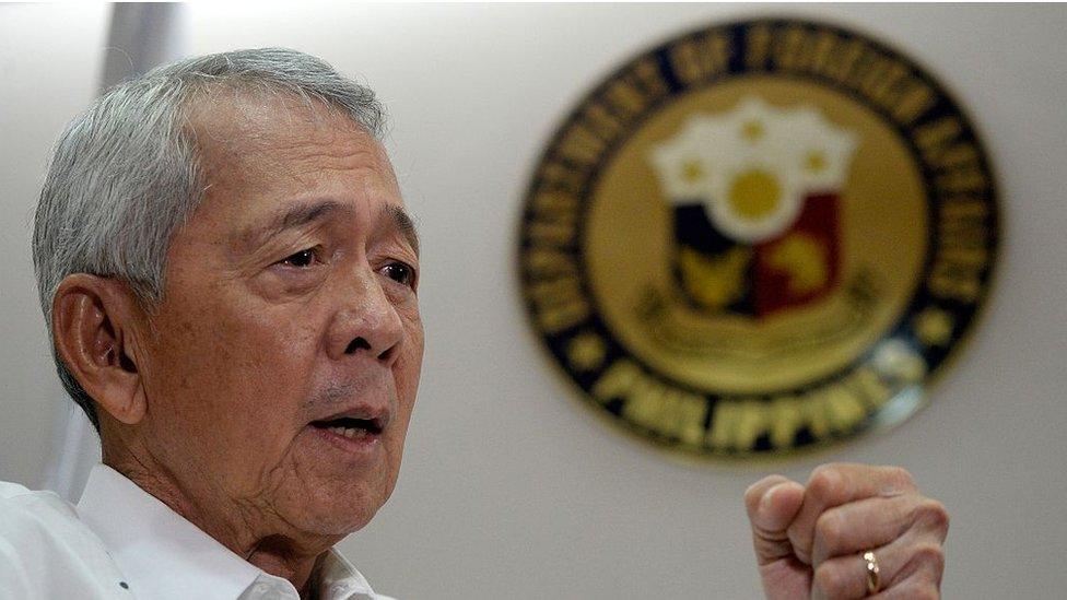 Philippine Foreign Secretary Perfecto Yasay gestures during an interview in Manila on July 8, 2016.