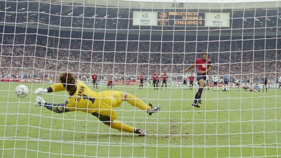 David Seaman saves a penalty from Spain player Angel Nadal.