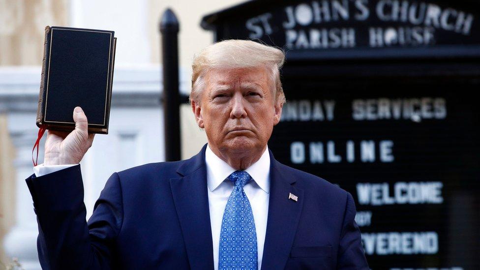 president-trump-holding-up-bible-outside-of-st-johns-church