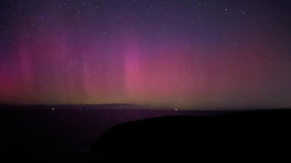 Pink glow in the sky at Portreath beach