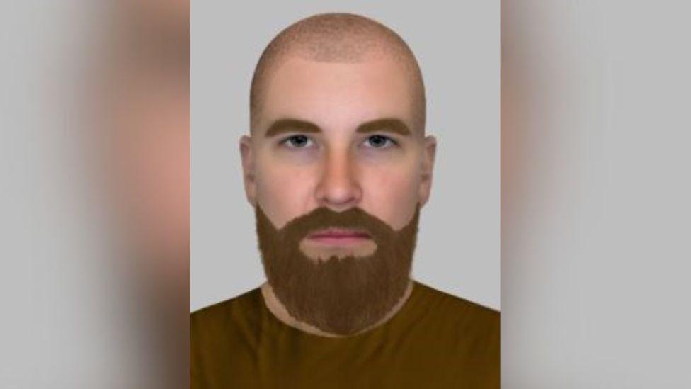 A computer-generated image of a white man wearing a brown jumper. He has a bald head and brown beard and is looking straight into the camera with a neutral expression.