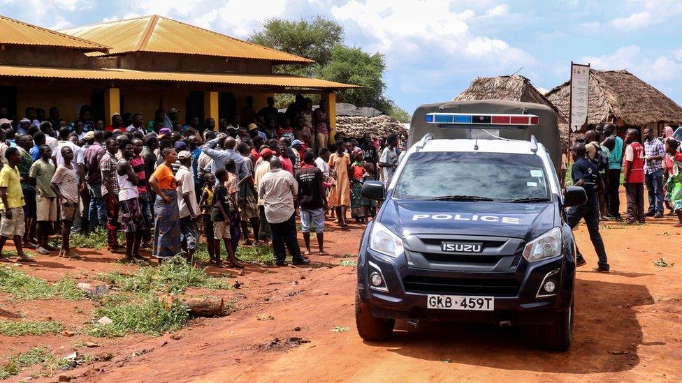 Police car in front of crowd