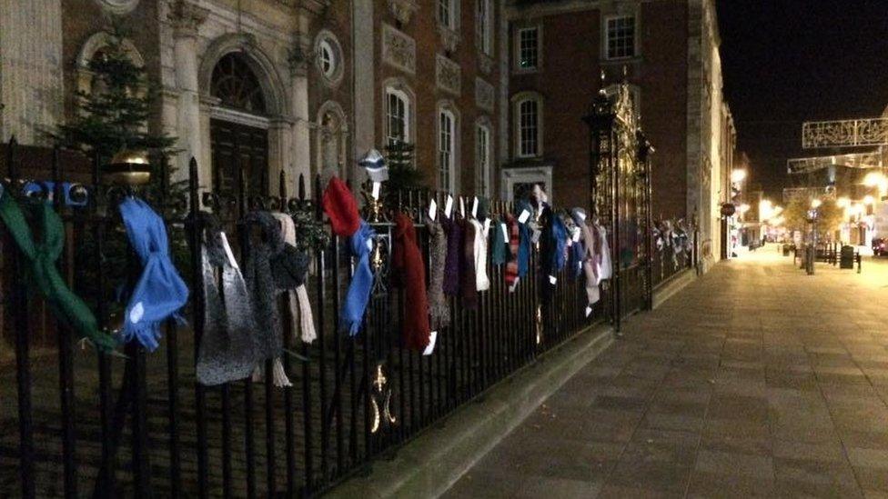 Scarves hanging on the railings outside Worcester Guildhall