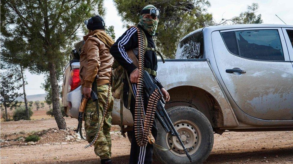 Two rebel fighters near the town of Bizaa, in the suburbs of the Syrian town of al-Bab