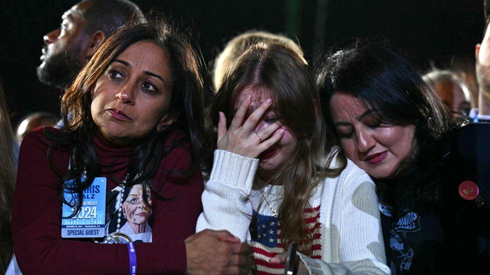 Attendees react during an election night event with US Vice President Kamala Harris, not pictured, in Washington, DC, US, on Tuesday, Nov. 5, 2024.