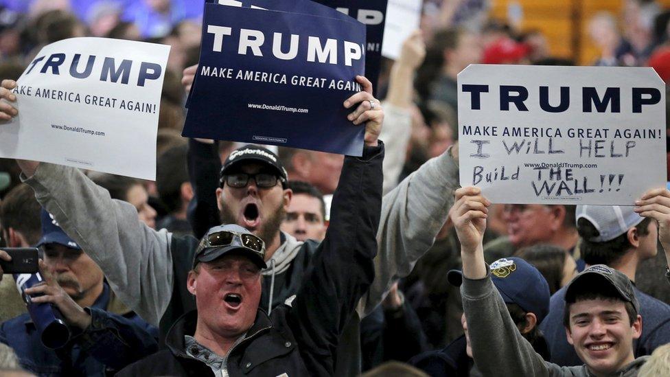 Supporters of U.S. Republican presidential candidate Donald Trump cheer at a campaign rally in Cadillac, Michigan, March 4, 2016.