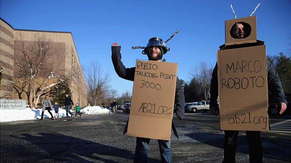 Men dressed a Marco Rubio robots