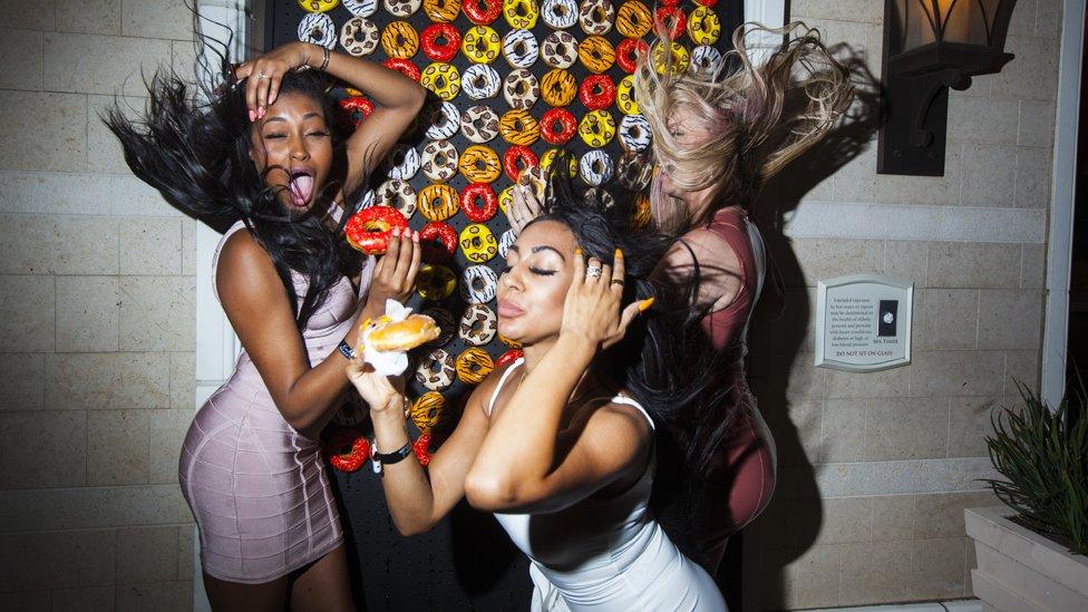 Attendees of the Best of Las Vegas Weekly celebration react to a sudden gust of wind while posing for a photo at the Encore resort in Las Vegas on 19 September 2018.