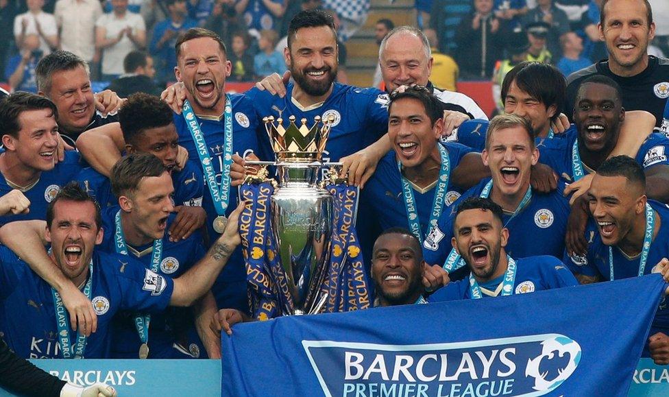 Leicester City players with the Premier League trophy