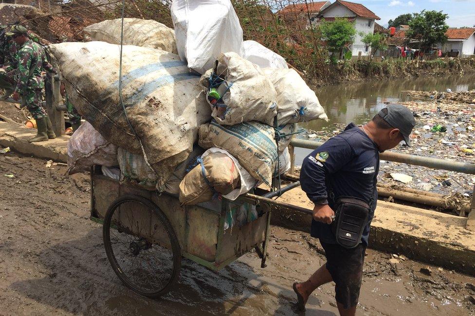 Soldier removing waste