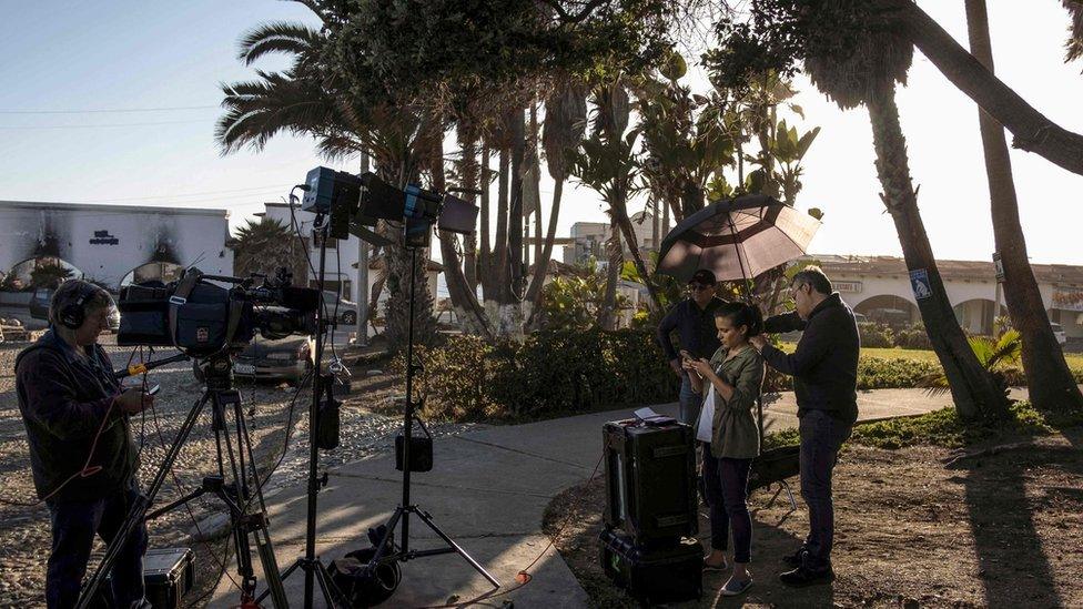 Journalists work in front of the residential area where Thomas Markle, the father of Meghan Markle, lives