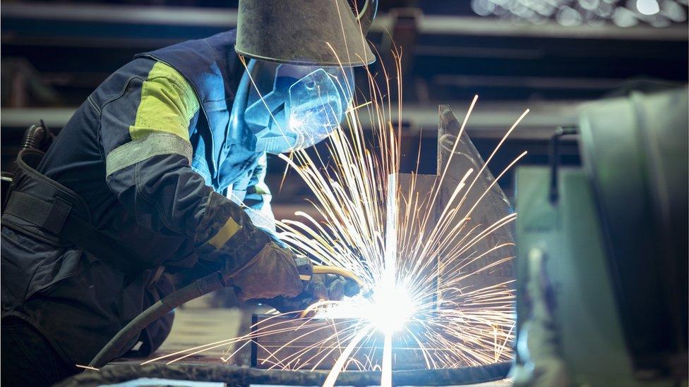 A welder at a steel plant