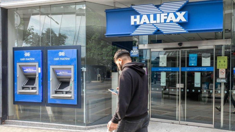 Man walking past Halifax bank