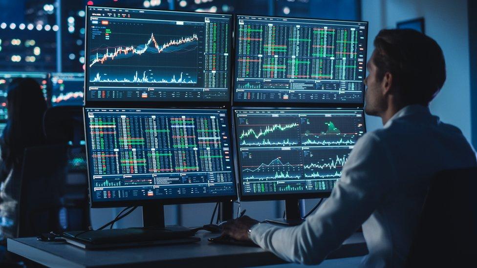 Stock trader at desk