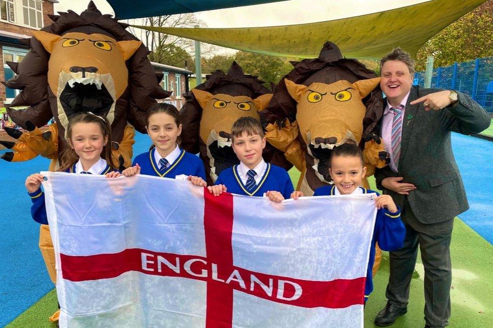 Head teacher and school pupils