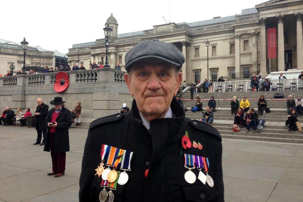 Veteran Raymond Champion wearing his father's war medals