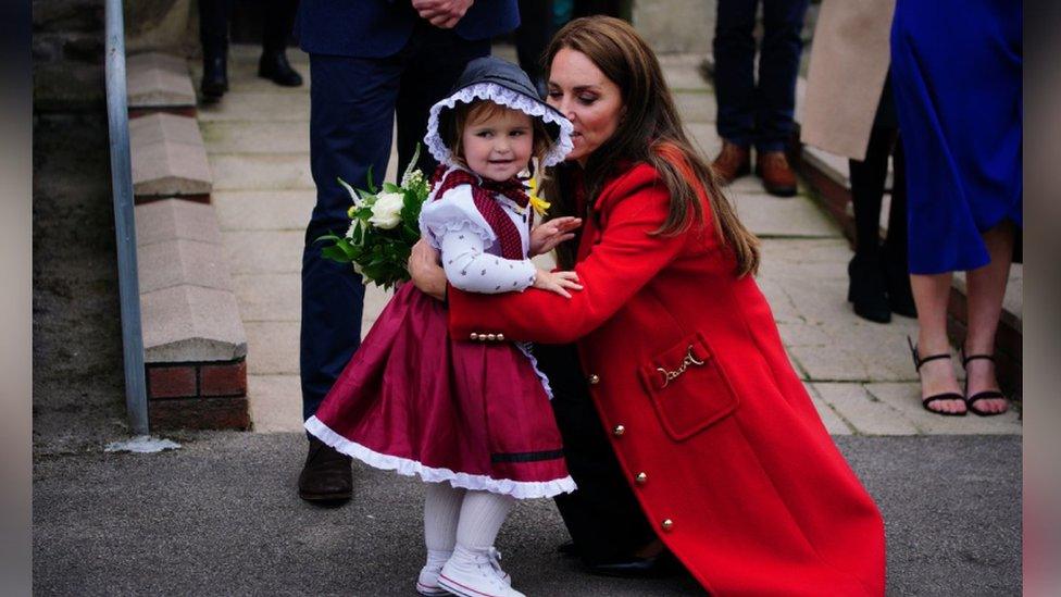 The Princess of Wales receives a posy of flowers from Charlotte Bunting, aged two, as she leaves after a visit to St Thomas Church, in Swansea, Wales. Picture date: Tuesday September 27, 2022.