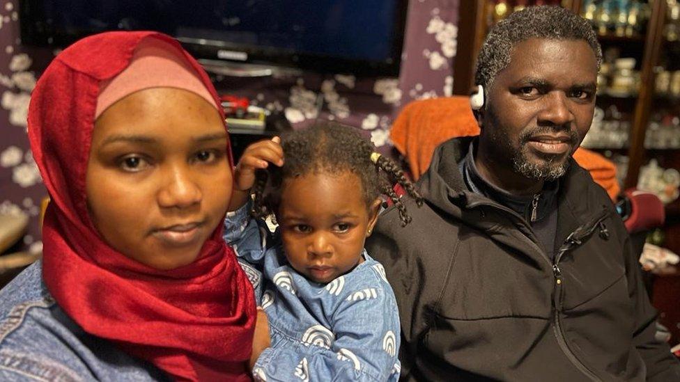 Yousif, his wife and one of their children.