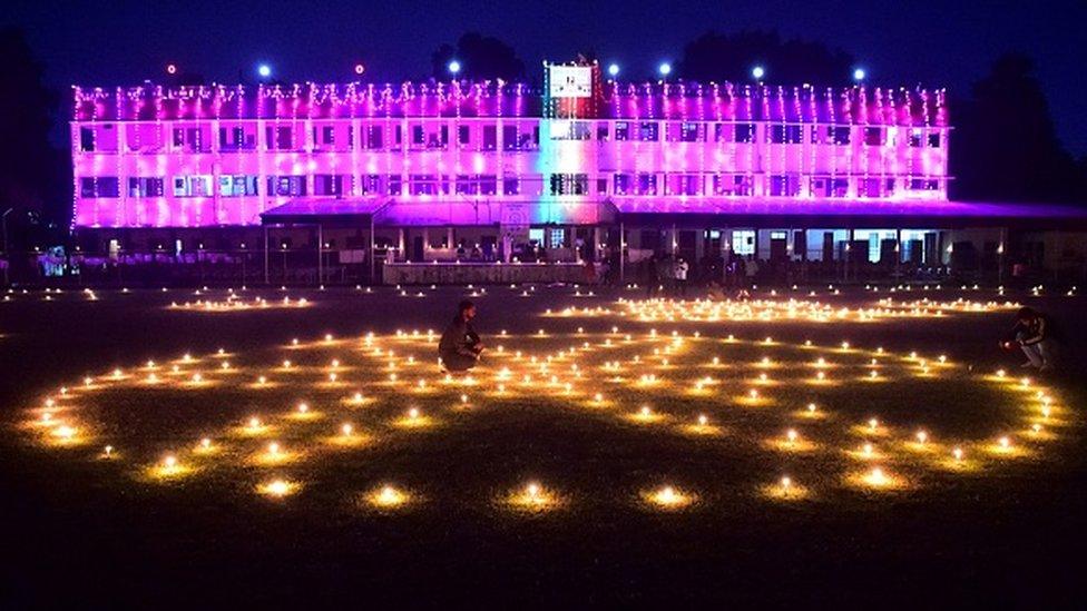 A general view of the Madan Mohan Malviya Stadium decorated with candles by athletes is pictured during track pujan ceremony ahead of the Hindu festival of Diwali in Allahabad on November 2, 2021.