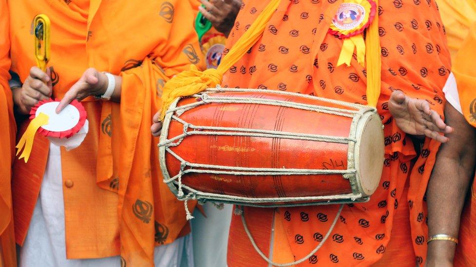 Sikhs playing music instruments