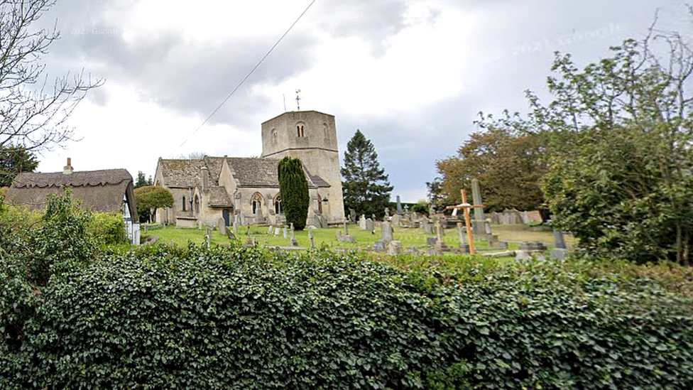 Church of St Lawrence viewed over a hedge