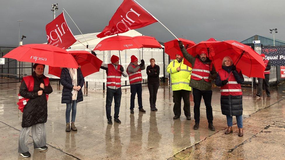 Striking government vets waving Nipsa flags