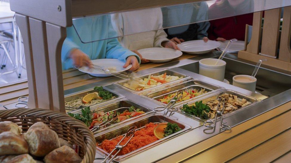 Children collecting food at a school canteen