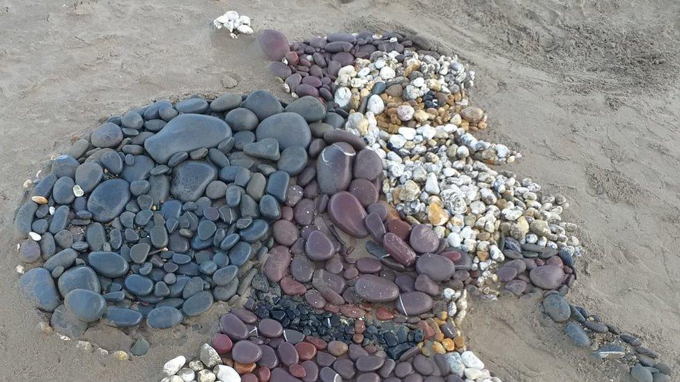 Beach art showing Father Christmas