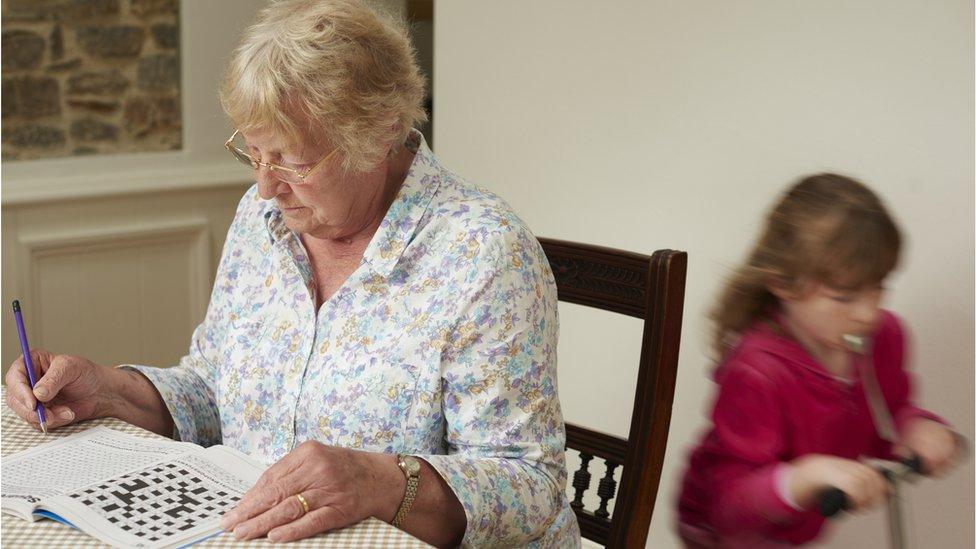 Woman doing crossword puzzle