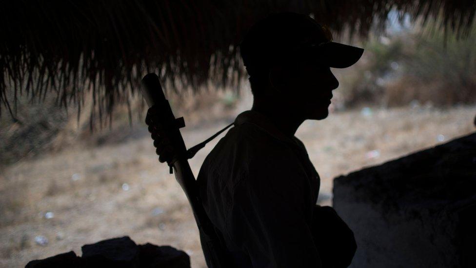 File image policeman at a checkpoint in Apaxtla de Castrejon, Guerrero state, Mexico, on March 26, 2018