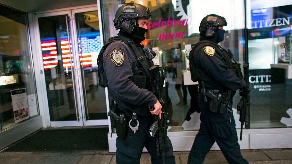 NYPD officers patrol after two women and a four-year-old girl were injuring by gun fire in Times Square, New York on May 8, 2021