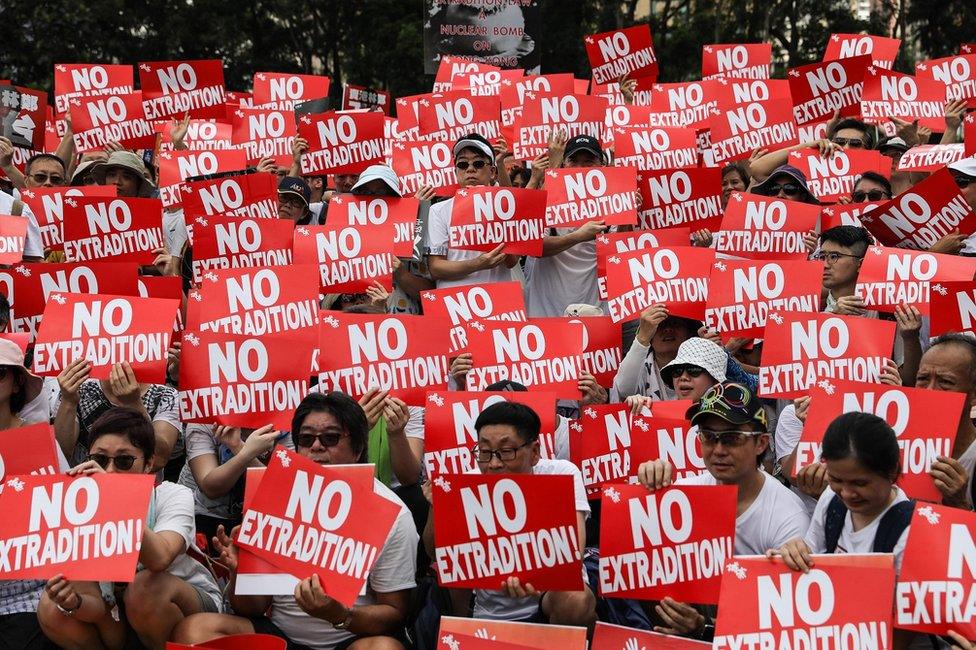 Protesters attend a rally against a controversial extradition law proposal in Hong Kong on 9 June 2019