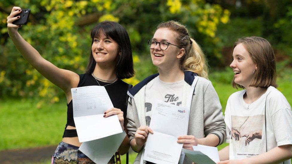 Students pose for a photograph with their A Level results at Ffynone House School in Swansea