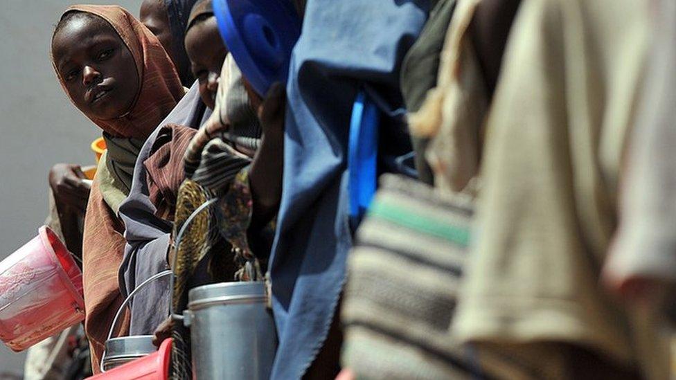 Somalis collecting water at a camp in 2012