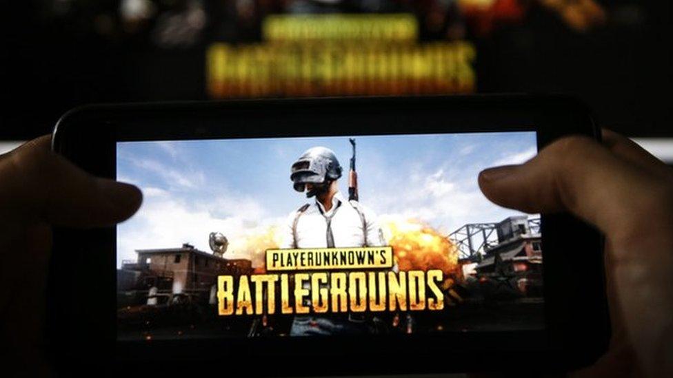 A man plays PUBG game on smartphone in Ankara, Turkey on November 26, 2018