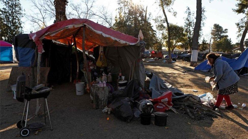 A family of Mexican migrants camps at a park while waiting to apply for asylum in the US in Ciudad Juarez