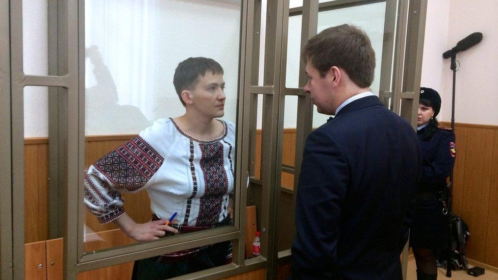 Ukrainian army pilot Nadia Savchenko talks to her lawyer Ilya Novikov from glass-walled cage in court hearing in town of Donetsk in Rostov region, Russia, March 3, 2016