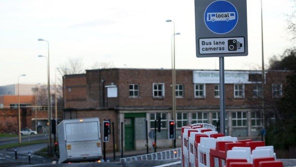 A road sign warning motorists of a bus lane camera