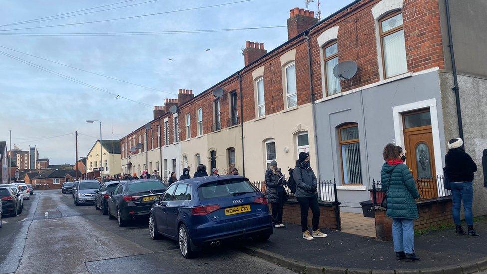 People queue in Short Strand for a booster vaccination